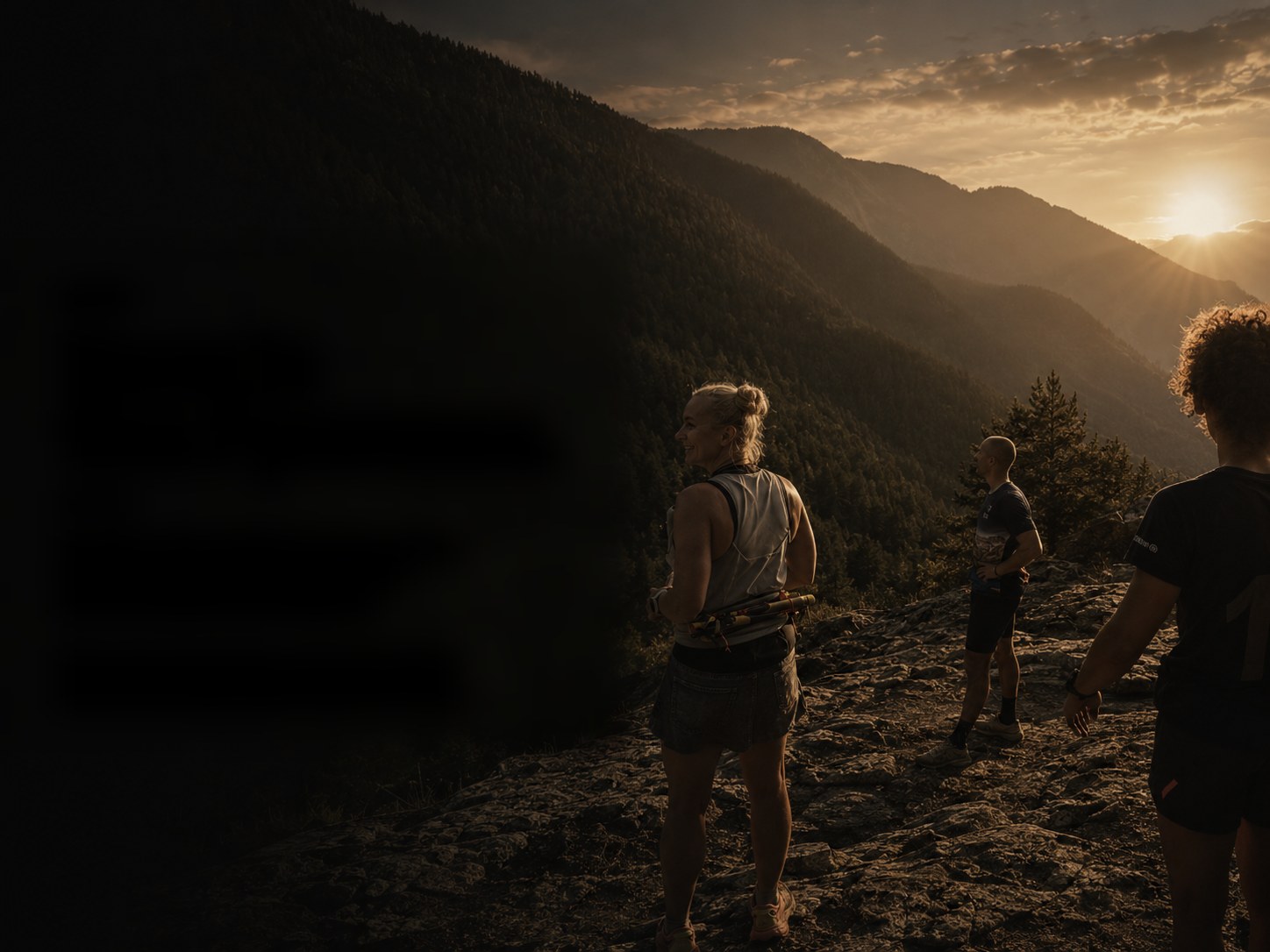 UNBTN founders and athletes on a ridge above Ordino, Andorra, watching the sun set over the Pyrenees.